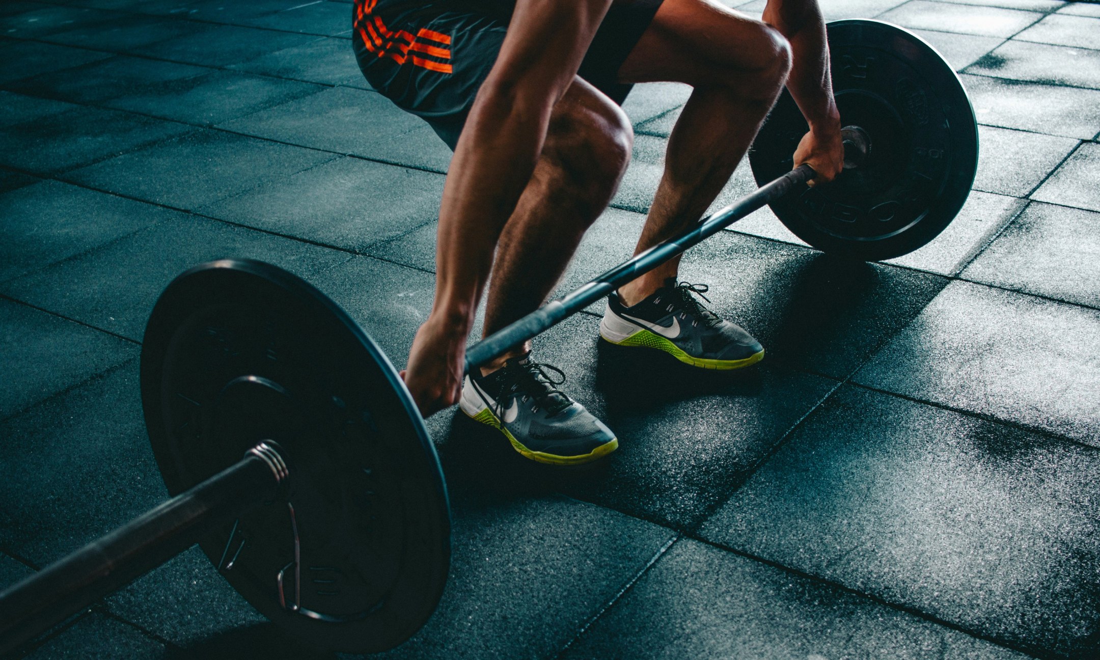 Fitness person lifting dumbell